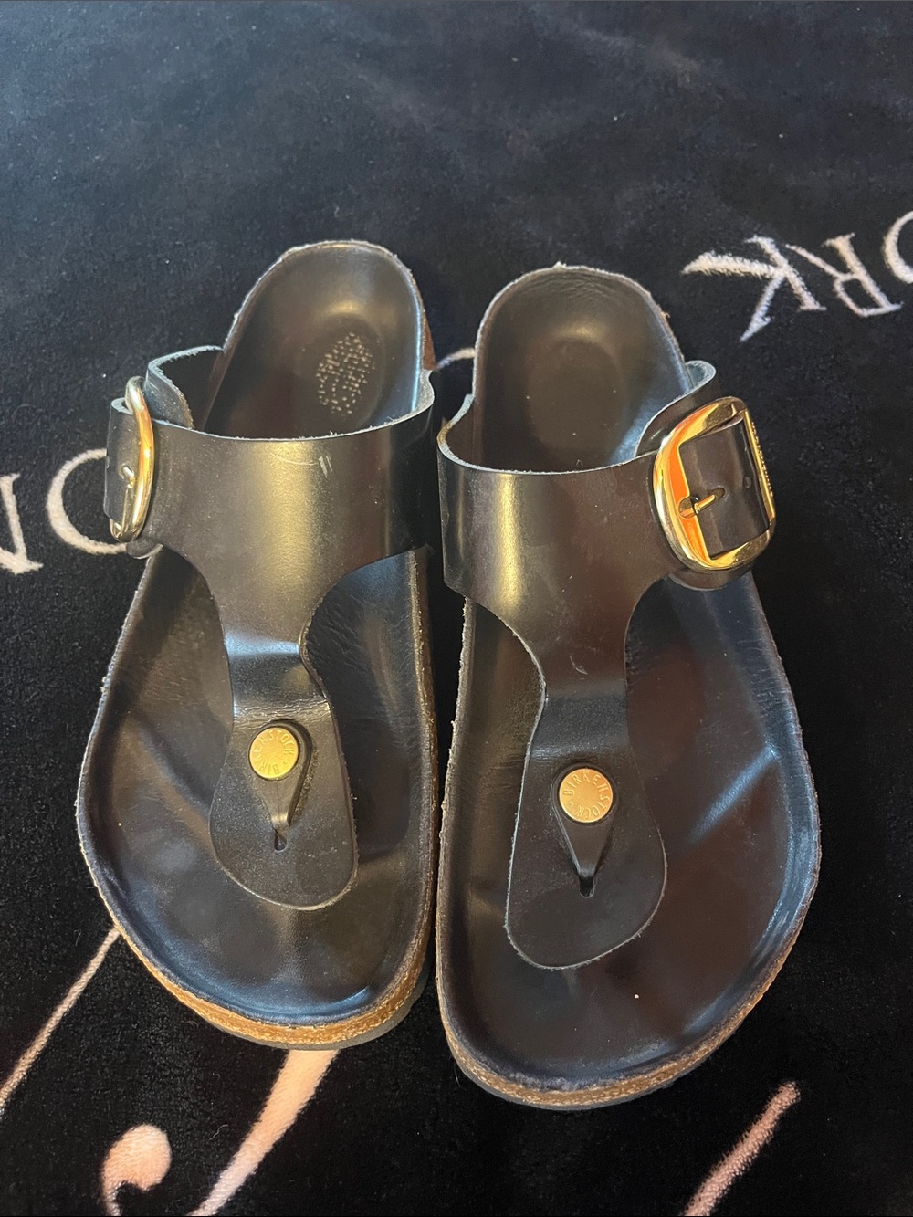 Birkenstock Black Thong Sandals with Gold Buckle